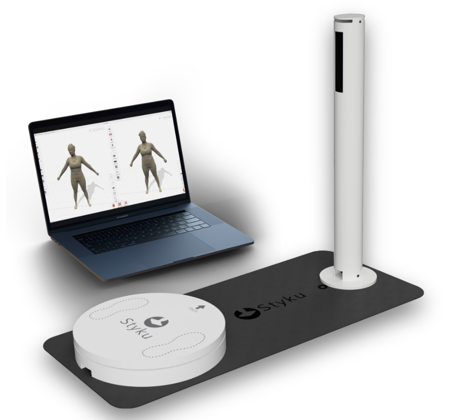 Styku X2 Pro complete 3D body scanning system — turntable, sensor tower, and laptop showing body composition results